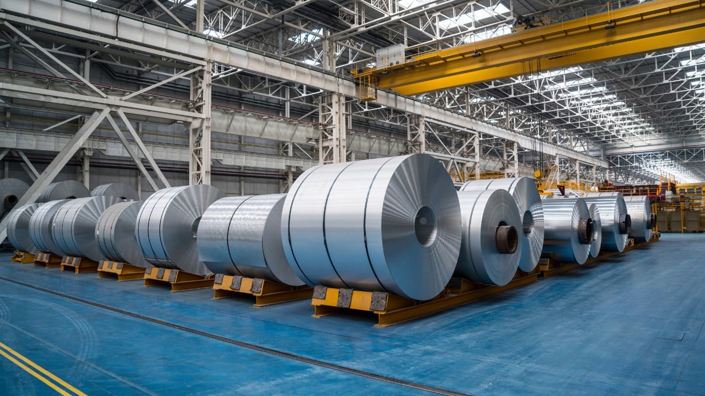 Rolls of desheng steel being processed in a factory, ready for manufacturing